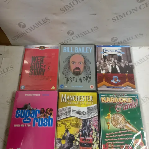 BOX OF APPROXIMATELY 15 ASSORTED DVDS TO INCLUDE BILL BAILEY, KARAOKE CAROLS, MANCHESTER THROUGH THE AGES ETC