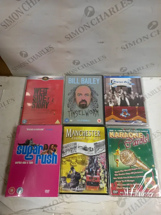 BOX OF APPROXIMATELY 15 ASSORTED DVDS TO INCLUDE BILL BAILEY, KARAOKE CAROLS, MANCHESTER THROUGH THE AGES ETC