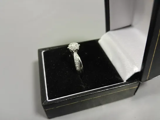 9CT WHITE GOLD RING WITH NATURAL DIAMOND HALO AND TWIST SHOULDERS