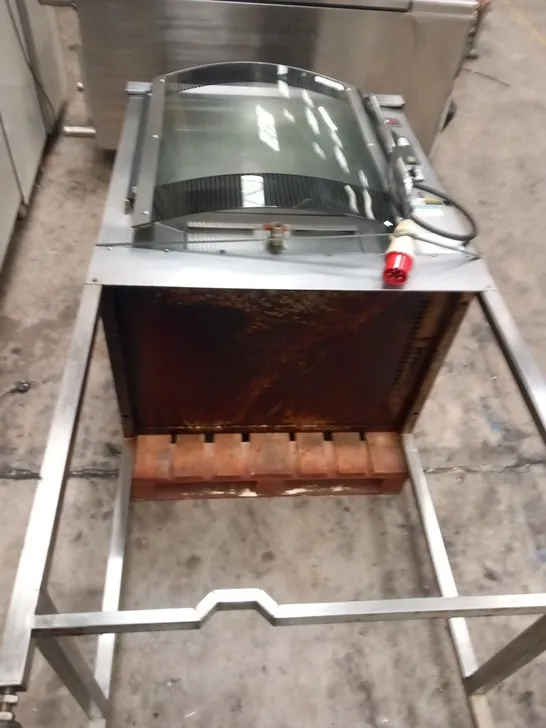 BKI ROTISSERIE OVEN ON METAL STAND