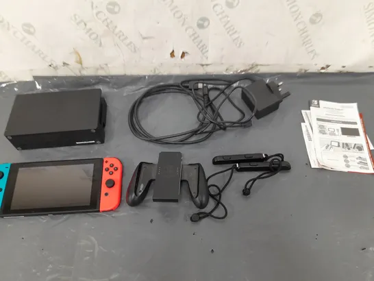 UNBOXED NINTENDO SWITCH WITH ACCESSORIES AND WIRES 