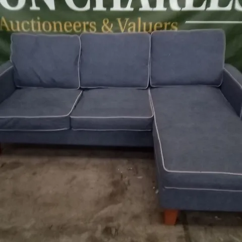 DESIGNER BLUE FABRIC CORNER SOFA WITH GREY PIPING AND OAK EFFECT FEET