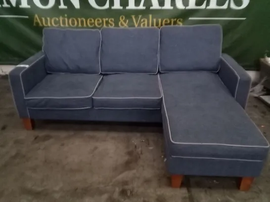 DESIGNER BLUE FABRIC CORNER SOFA WITH GREY PIPING AND OAK EFFECT FEET