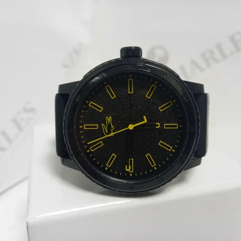 LACOSTE BLACK DIAL YELLOW ACCENT RUBBER STRAP WATCH 