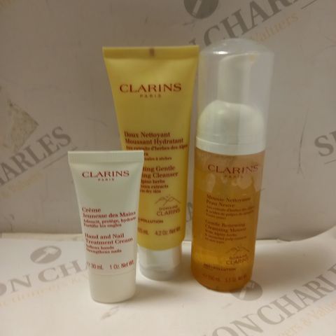 LOT OF 3 ASSORTED CLARINS PRODUCTS TO INCLUDE HYDRATING FOAMING CLEANSER, CLEANSING MOUSSE, HAND & NAIL TREATMENT 