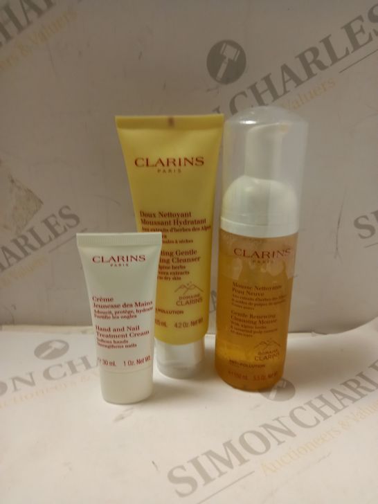 LOT OF 3 ASSORTED CLARINS PRODUCTS TO INCLUDE HYDRATING FOAMING CLEANSER, CLEANSING MOUSSE, HAND & NAIL TREATMENT 