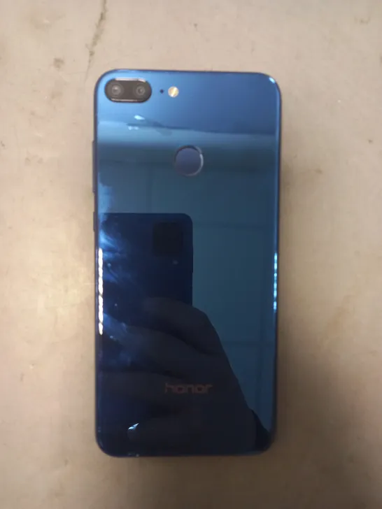 HONOR LLD-L31 MOBILE PHONE IN BLUE