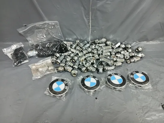 LARGE QUANTITY OF ASSORTED WHEEL LUGNUTS WITH 4 BMW WHEEL HUB CAPS 