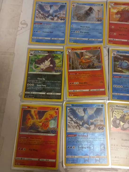 LOT OF 24 ASSORTED POKEMON CARDS