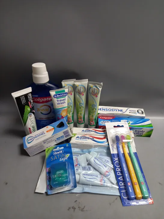 LOT OF ASSORTED DENTAL CARE PRODUCTS INCLUDING TOOTHBRUSHES AND CHILDREN'S TOOTHPASTE