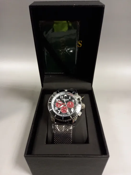 BOXED GAMAGES CONTEMPORARY SPORTS STEEL BLACK DIAL WATCH 