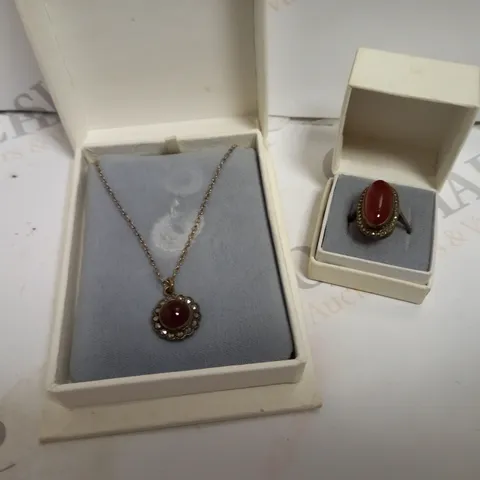 SHIPTON & CO LTD SILVER OVAL CUT RING AND ROUND CUT NECKLACE SET WITH RUBY EFFECT STONES