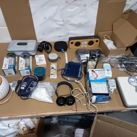 LOT OF APPROXIMATLY 15 ITEMS TO INCLUDE JAM WIRELESS HEADPHONES, MARLEY GET TOGETHER MINI, AND HOMEDICS SUO PLUS ETC.