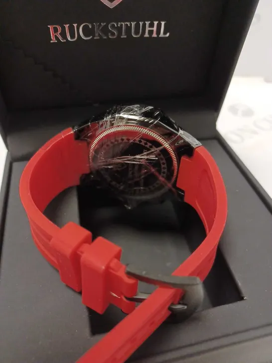 RUCKSTUHL OCTAGONAL BLACK TRIPLE DIAL STUD RED RUBBER STRAP WATCH