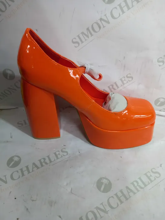 PAIR OF KOI VEGAN LEATHER HIGH HEEL SQUARED TOE PLATFORM SHOES IN A SHINY ORANGE DESIGN - SIZE 7