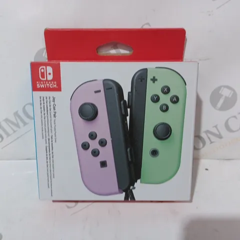 BOXED NINTENDO SWITCH JOY-CON PAIR IN PASTEL PURPLE AND PASTEL GREEN