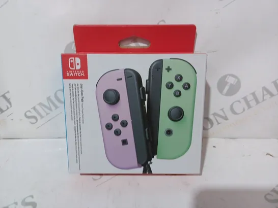 BOXED NINTENDO SWITCH JOY-CON PAIR IN PASTEL PURPLE AND PASTEL GREEN