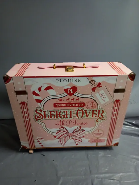 PLOUISE SLEIGH OVER SUITCASE