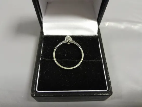 18CT GOLD SOLITAIRE RING SET WITH A NATURAL PEAR CUT DIAMOND WEIGHING