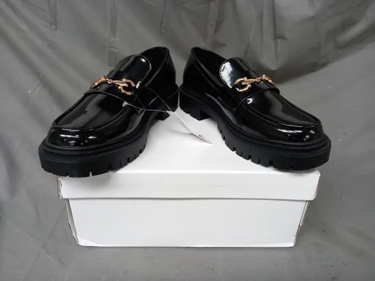 BOXED PAIR OF TRUFFLE COLLECTION LOAFERS IN GLOSSY BLACK W. GOLD EFFECT DETAIL SIZE 5