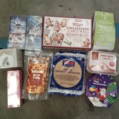 PALLET OF ASSORTED ITEMS INCLUDING DRAGON BALL PHONE CASES, SPECIAL MADRAS POPPADOMS, CADBURY CHRISTMAS TREE DECORATIONS, UV NAIL LAMP, GINGERBREAD CHRISTMAS DECORATING KIT, POPYUM PEANUT CHEW POPCORN