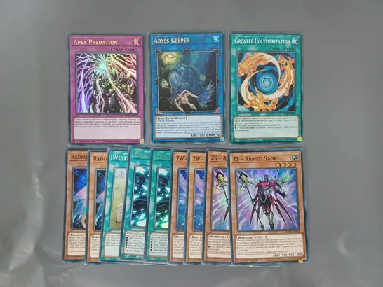 SMALL ASSORTMENT OF YU-GI-OH COLLECTIBLE TRADING CARDS TO INCLUDE APEX PREDATION, ABYSS KEEPER, GREATER POLYMERIZATION, ETC