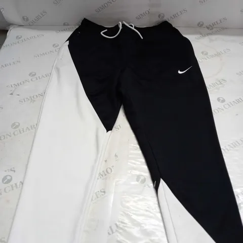 NIKE TRACK PANTS IN BLACK & WHITE - M