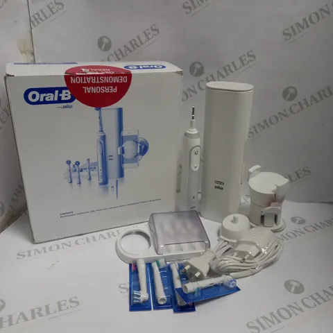 BOXED BRAUN ORAL-B DENTAL KIT TO INCLUDE RECHARGEABLE TOOTHBRUSH, TRAVEL CASE, CHARGING STATION, SMARTPHONE HOLDER, AND BRUSH HEADS