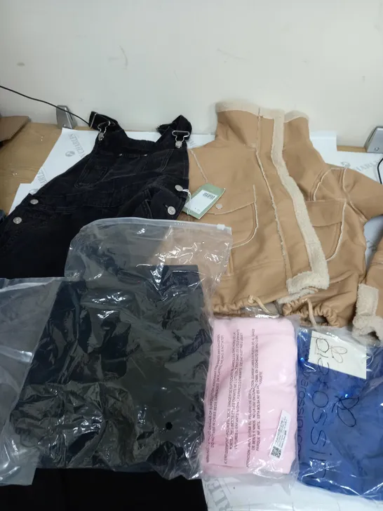 LARGE BOX OF ASSORTED CLOTHING ITEMS IN VARIOUS COLOURS AND SIZES INCLUDING TROUSERS , TOPS AND JUMPERS 