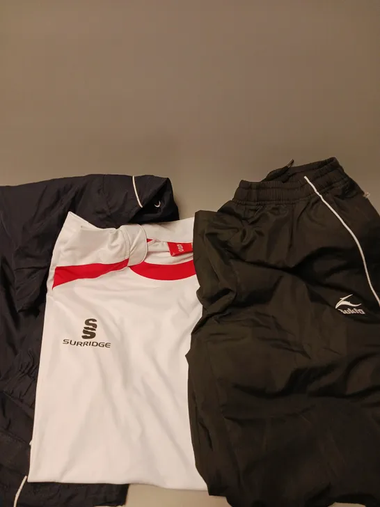 APPROXIMATELY 10 ASSORTED SPORTS CLOTHING PRODUCTS IN VARIOUS SIZES TO INCLUDE TRACKSUITS, SHORTS, TSHIRTS ETC 