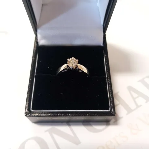 PLATINUM SOLITAIRE RING SET WITH A NATURAL DIAMOND