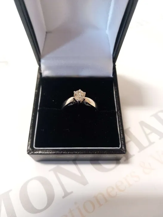 PLATINUM SOLITAIRE RING SET WITH A NATURAL DIAMOND