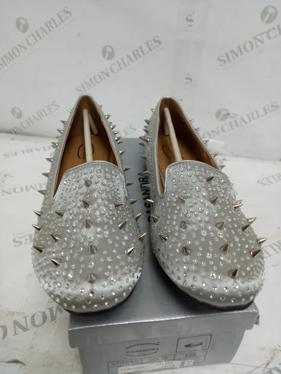 BOX OF APPROXIMATELY 7 CASANDRA FLAT SPIKED SILVER SATIN SHOES 