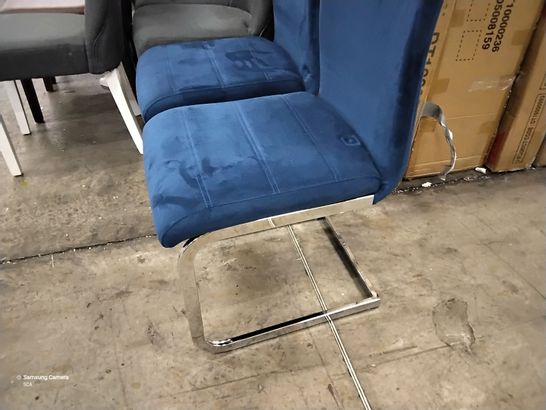 PAIR OF BLUE VELVET UPHOLSTERED DINING CHAIRS ON CHROME SUPPORTS 