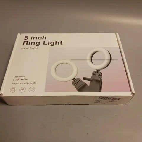 UNBRANDED 5 INCH RING LIGHT 3 LIGHT MODES, ADJUSTABLE BRIGHTNESS AND ADJUSTABLE SILICONE BASE STAND INCLUDED