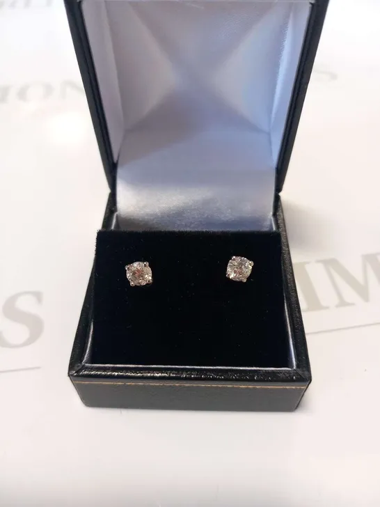 PLATINUM STUD EARRINGS SET WITH NATURAL DIAMONDS WEIGHING +0.83CT
