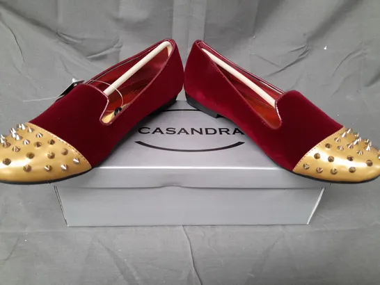 BOX OF APPROXIMATELY 12 BOXED PAIRS OF CASANDRA SLIP-ON SHOES IN RED/GOLD W. SPIKE STUDS - VARIOUS SIZES