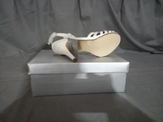 APPROXIMATELY 12 BOXED PAIR OF CASANDRA IVORY HEELED SANDALS IN VARIOUS SIZES TO INCLUDE SIZE 5