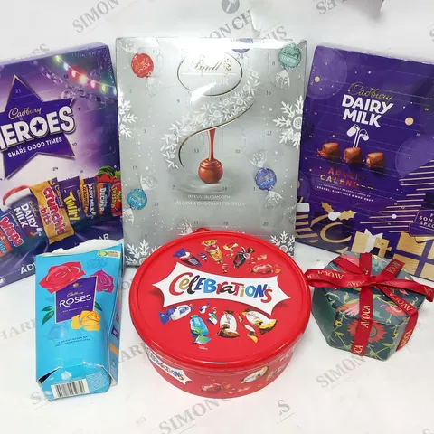 APPROXIMATELY SIX ASSORTED FOOD PRODUCTS TO INCLUDE; CADBURY'S ADVENT CALENDERS, LINDT ADVENT CALENDER, CELEBRATIONS, ROSES AND CHRISTMAS PUDDING