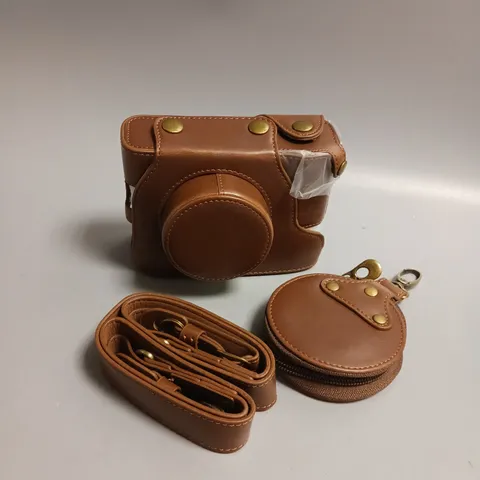 UNBRANDED LEATHER CAMERA CASE WITH STRAP AND CLIP ON LENS POUCH IN BROWN WITH BRASS DETAILING APPROX 13CM LENGTH, 4.5CM WIDTH AND 9CM HEIGHT