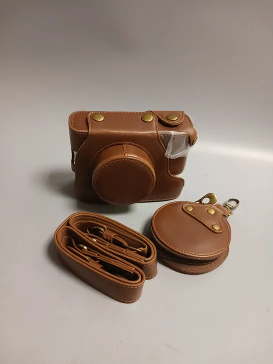 UNBRANDED LEATHER CAMERA CASE WITH STRAP AND CLIP ON LENS POUCH IN BROWN WITH BRASS DETAILING APPROX 13CM LENGTH, 4.5CM WIDTH AND 9CM HEIGHT