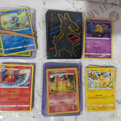 LOT OF ASSORTED POKÉMON TRADING CARDS AND CARD SLEEVES