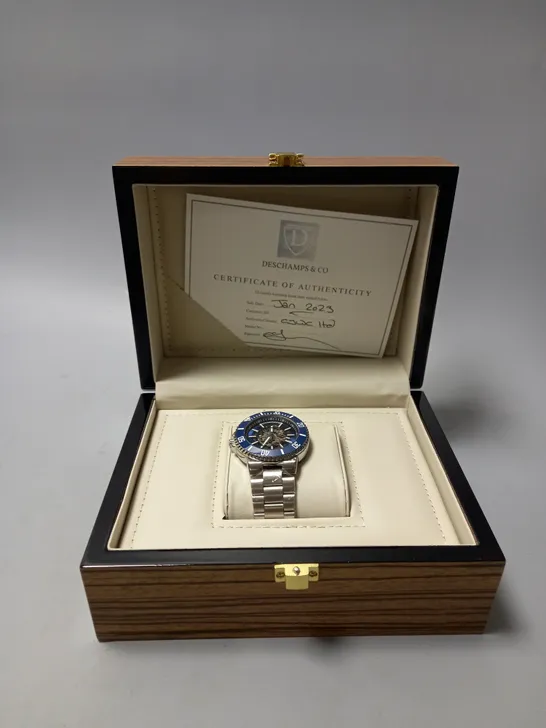 MENS DESCHAMPS & CO AUTOMATIC WATCH – SKELETON DIAL – CERAMIC BEZEL - STAINLESS STRAP – WOODEN GIFT BOX 