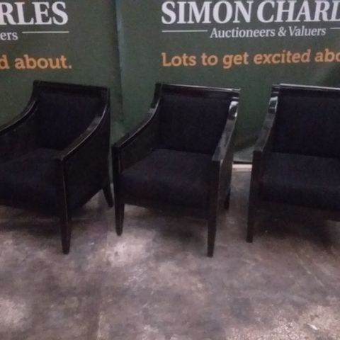 3 DESIGNER GUARDARTE BLACK UPHOLSTERED AND RATTAN EFFECT ARM CHAIRS