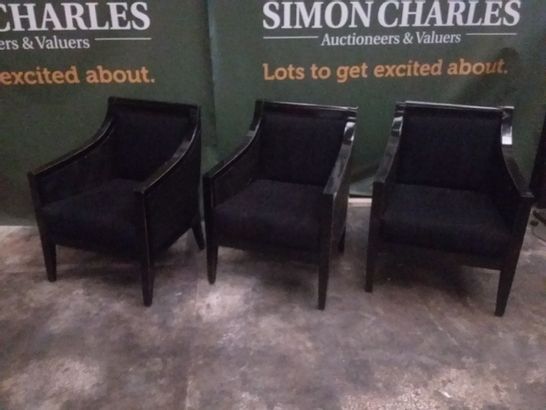 3 DESIGNER GUARDARTE BLACK UPHOLSTERED AND RATTAN EFFECT ARM CHAIRS