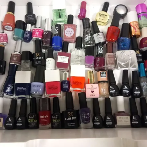 APPROXIMATELY 90 ASSORTED NAIL VARNISH/GELS TO INCLUDE; REVOLUTION, STAR GAZER, BLUESKY, CRYSTAL NAILS, SALLY HANSEN, NAILS INC, MILD EAST AND CLAIRE'S
