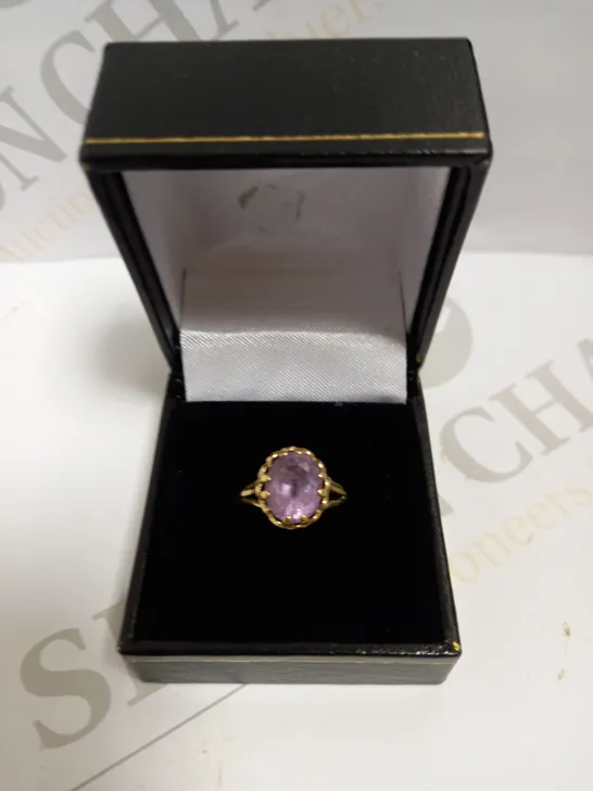 BOXED GOLD EFFECT RING WITH PURPLE SPARKLE STONE