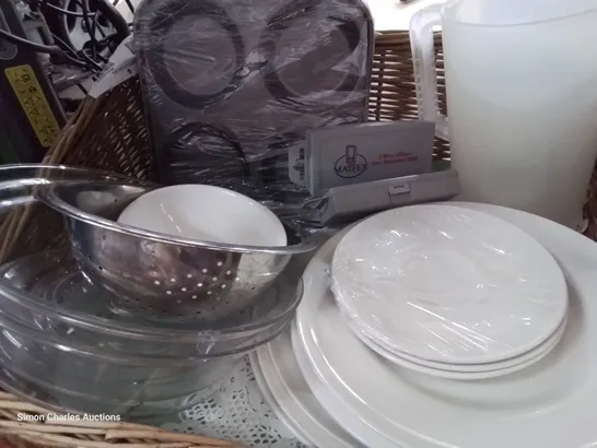 TWO WICKER BREAD BASKETS CONTAINING ASSORTED CATERING ITEMS, INCLUDING PLATTERS, TRAYS, CROCKERY, WIRE STRAINERS.