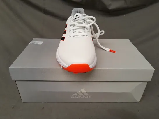 BOXED PAIR OF ADIDAS ZG23 GOLF SHOES IN WHITE/BLACK/ORANGE UK SIZE 7