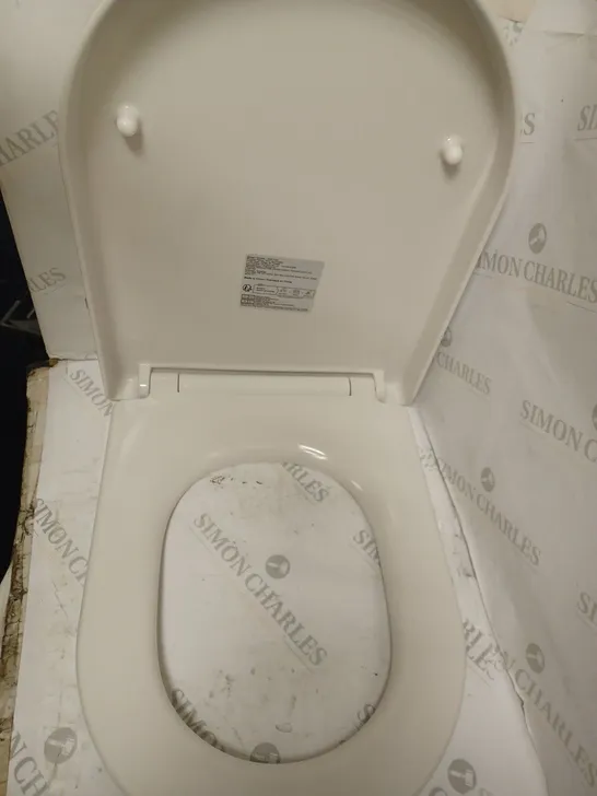 WHITE TOILET SEAT.